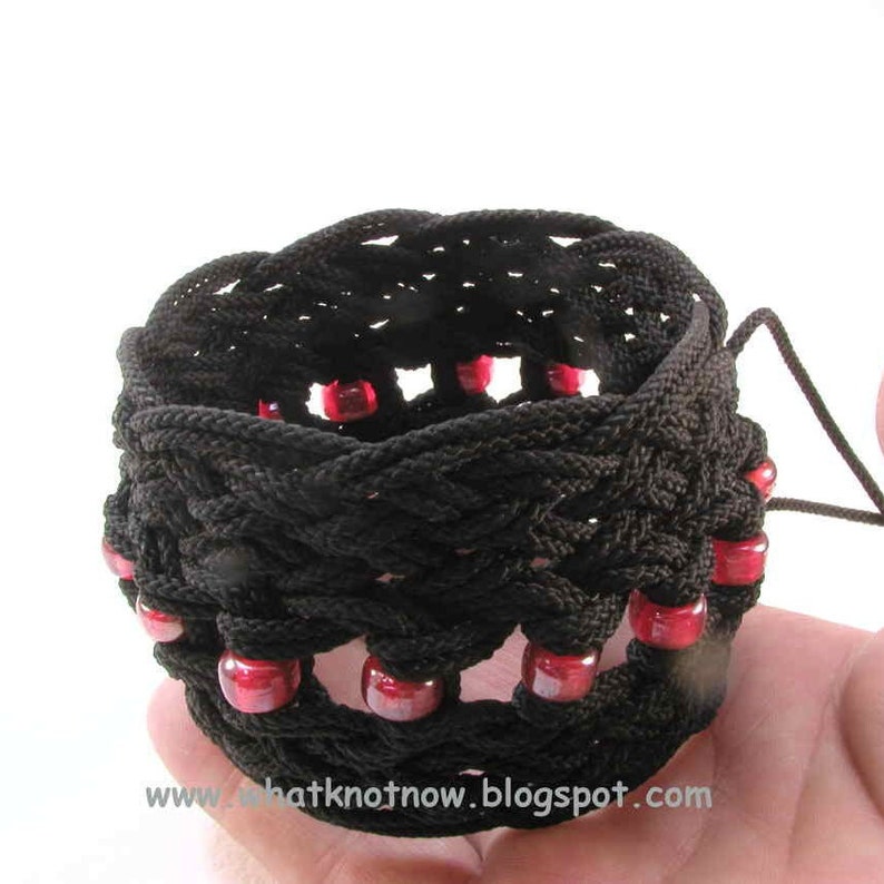 black nylon star knot rope bracelet with red beads in hand by WhatKnotShop on ETSY