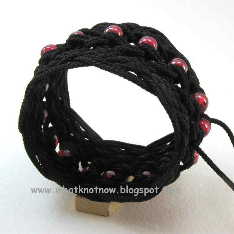 tunnel view of black nylon star knot rope bracelet with red beads by WhatKnotShop on ETSY