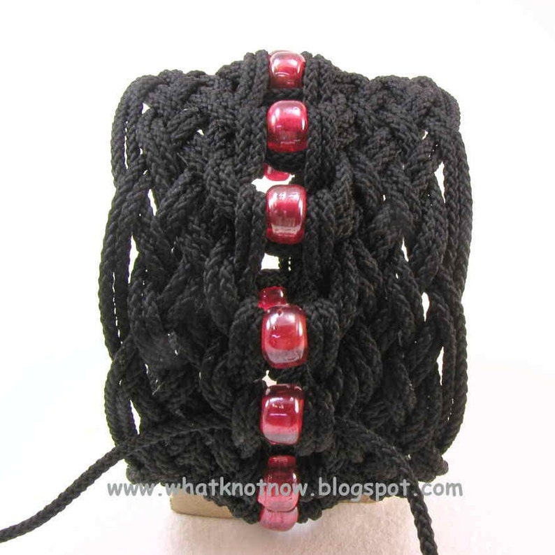 edge view of black nylon star knot rope bracelet with red beads by WhatKnotShop on ETSY