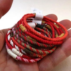 three red string bracelets S 4941