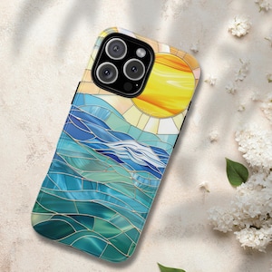 May include: A smartphone case featuring a stained-glass design of a sunny seascape. The case has a black border and a vibrant image of a yellow sun, blue waves, and green water. The design is reminiscent of a mosaic, with gold-colored lines separating the colors.
