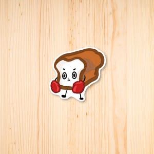 May include: A cartoon illustration of a slice of bread wearing boxing gloves. The bread has a white face with two black eyes and a frowning mouth.