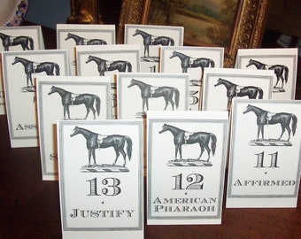 May include: A set of 10 white table cards with black horse illustrations and numbers. The cards are numbered 1 through 13, with the names of famous racehorses printed below the numbers. The names include Justify, American Pharaoh, and Affirmed.