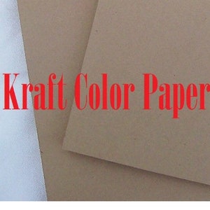 May include: Kraft Colour Paper, a close-up of two sheets of paper, one white and one brown.