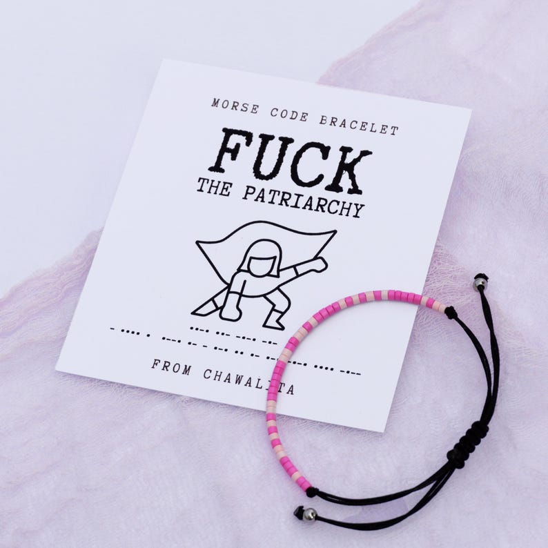 May include: A black and white illustration of a superhero with the text "FUCK THE PATRIARCHY" above it. A pink and white beaded bracelet with black string is on a white card with the text "MORSE CODE BRACELET" and "FROM CHAWALTA" on it.