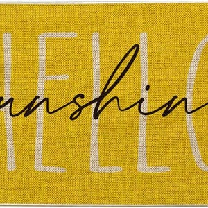 May include: Yellow rectangular mat with the words "HELLO sunshine" in white and black script. The mat has a textured appearance, and the text is centered on the mat.