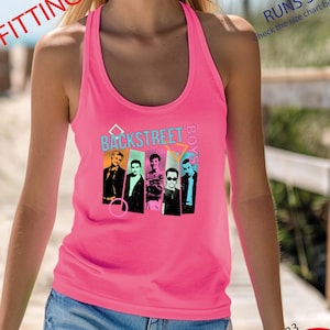 May include: Hot pink racerback tank top featuring a graphic of the Backstreet Boys. The tank top has the words "BACKSTREET BOYS" printed on the front. The text "FORM FITTING" and "RUNS SMALL" are also visible.
