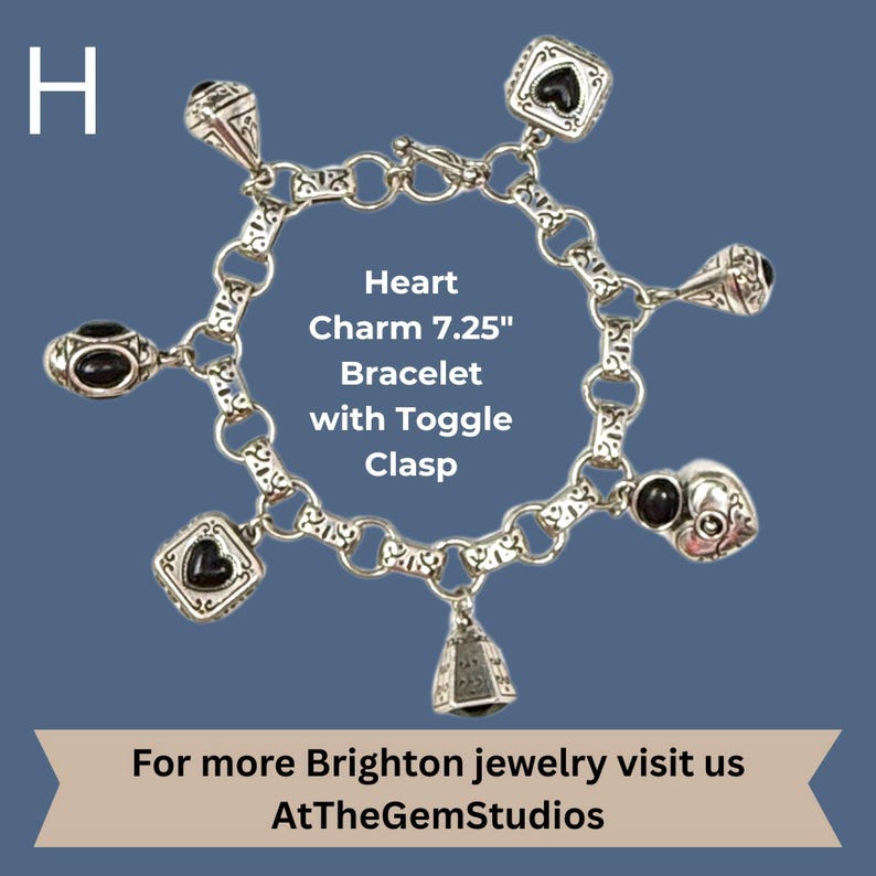 May include: A silver-toned charm bracelet with a toggle clasp, featuring heart-shaped charms with black accents. The bracelet is 7.25 inches long and includes a bell charm. Text on the image reads "Heart Charm 7.25" Bracelet with Toggle Clasp."