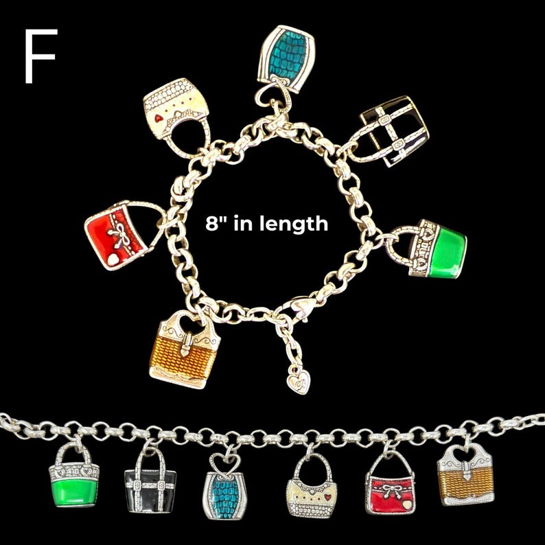 May include: Silver charm bracelet featuring colorful handbag charms. The bracelet is 8 inches in length and includes charms in red, green, blue, and gold. The charms are detailed with enamel and decorative accents.