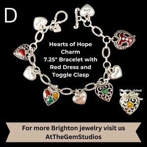 May include: A silver charm bracelet with heart-shaped charms. The bracelet is 7.25 inches long and features a toggle clasp. The charms include red, green, and yellow accents, and the text "Hearts of Hope Charm" is displayed.