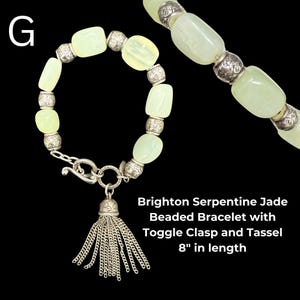 May include: A Brighton Serpentine jade beaded bracelet with a toggle clasp and tassel. The bracelet is 8 inches in length. The bracelet features pale green jade beads and silver-toned accents.