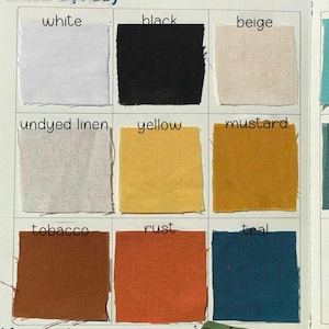 May include: A color swatch chart featuring nine fabric samples in various colors. The colors include white, black, beige, undyed linen, yellow, mustard, tobacco, rust, and teal. Each swatch is labeled with its respective color name.