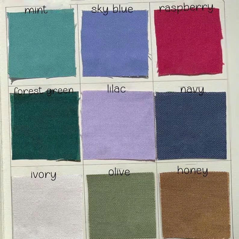 May include: A color swatch card featuring nine fabric samples in various colors. The colors include mint, sky blue, raspberry, forest green, lilac, navy, ivory, olive, and honey. Each swatch is labeled with its corresponding color name in black text.