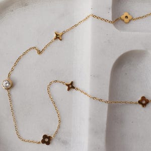 Delicate gold clover flower necklace