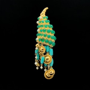 May include: A gold and green statement earring with a spiral design and turquoise and pearl accents.