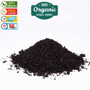 May include: A close-up of a pile of dark brown, finely ground organic coffee beans. The coffee beans are 100% organic and natural.