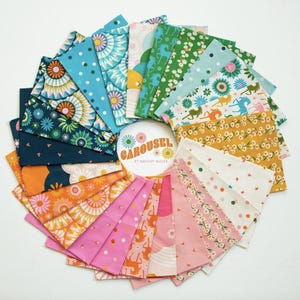 May include: A circular arrangement of patterned fabric squares in a variety of colours. Designs include florals, dots, and whimsical motifs in blue, pink, orange, and green. The centre features the text "Carousel by Melody Miller".