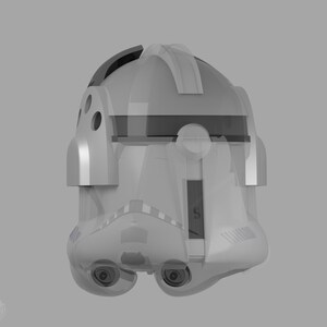 May include: A transparent, light gray helmet with a rounded top and a visor area. The helmet has two eye-like features and several small circular openings on the sides. The design suggests a futuristic or science fiction theme.