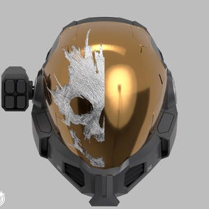 May include: A gold and black helmet with a silver skull design on the front. The helmet has a visor and a side attachment with four rectangular shapes. The design is futuristic and detailed.