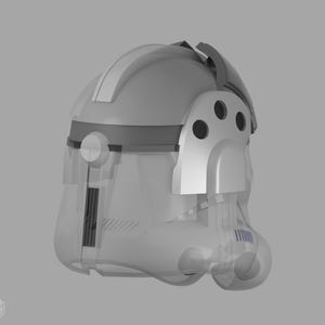May include: A gray and white helmet with a transparent visor. The helmet has a rounded top with a raised central ridge and a dark gray band around the middle. The side features a white panel with three circular openings.