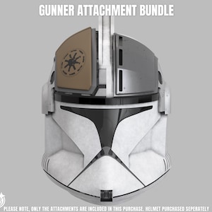 May include: A white helmet featuring the Gunner Attachment Bundle, which includes a tan visor piece with a circular emblem and a grey rectangular attachment. The text GUNNER ATTACHMENT BUNDLE appears at the top, with a disclaimer at the bottom.
