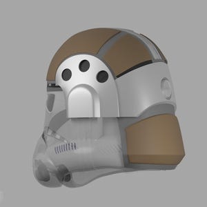 May include: A futuristic helmet design with a transparent visor and a combination of white, silver, and brown panels. The helmet features a rounded top and a distinctive front section with circular vents, suggesting a sci-fi or cosplay theme.