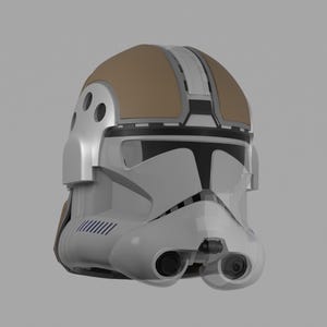 May include: A white and tan helmet with black accents. The helmet has a visor, two eye pieces, and a tan top. The helmet has a futuristic design and is likely for cosplay or display.