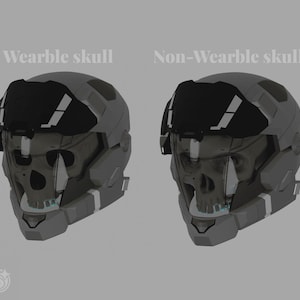 May include: Two gray futuristic helmets, one labeled "Wearable skull" and the other "Non-Wearable skull." Each helmet has a black visor and a skull-shaped faceplate. The helmets are set against a gray background.