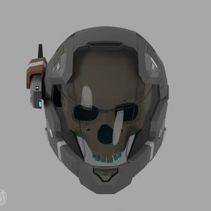 May include: A futuristic gray helmet with a transparent visor revealing a skull design. The helmet has angular features and a communication device on the side. The visor is tinted, and the skull is visible through it. The overall design suggests a sci-fi or gaming theme.