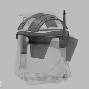 May include: A transparent and grey helmet with a curved visor and a tall antenna. The word "Left" is visible on the side. The helmet has a futuristic design, with a clear face shield and a complex internal structure.