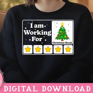 May include: Black sweatshirt with a white graphic that says "I am working for Christmas break" with a five-star rating system. The stars are filled in yellow.