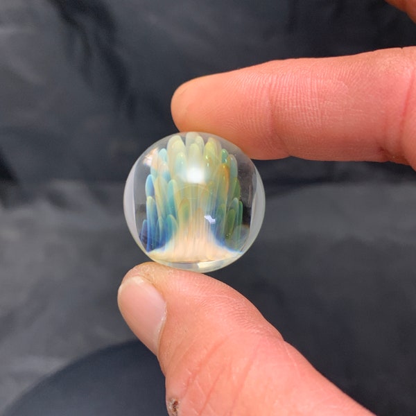 24.7mm handmade Silver and Gold Fumed glass marble.