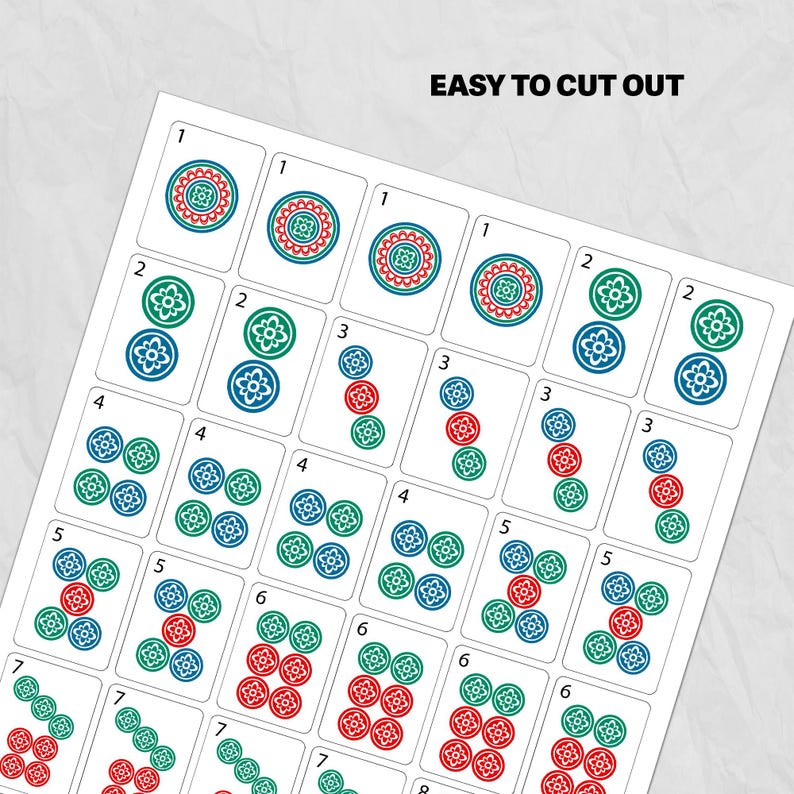 May include: A sheet of printed Mahjong tiles with red, green, and blue floral designs. The numbers 1 through 8 are displayed on the tiles. The text "EASY TO CUT OUT" is printed at the top of the sheet.