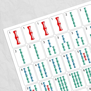 May include: A close-up of a sheet of Mahjong tiles. The tiles are white with various red, green, and blue bamboo symbols and numbers. The numbers range from 1 to 8. The tiles are arranged in a grid pattern.