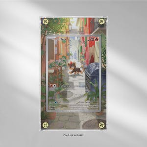 May include: A framed Pokémon trading card featuring the character 'Litleo' with a colorful background illustration of a European street scene. The card is encased in a clear protective holder with decorative corner accents. The text "Card not included" is at the bottom.