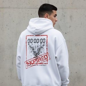 May include: White hoodie with a hood and a graphic on the back. The graphic includes a digital clock display reading "00:00:00", a pixelated design, and the word "EXPIRED" in a red stamp, with the text "TIME IS A SOCIAL CONSTRUCT".