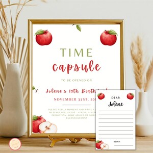 May include: A printable time capsule sign with red apples and the text "TIME capsule" and "TO BE OPENED ON Jolene's 18th Birthday NOVEMBER 31ST, 20__".  The sign also includes instructions to write a message for Jolene.  A separate printable card says "DEAR Jolene" and has lines for writing a message.