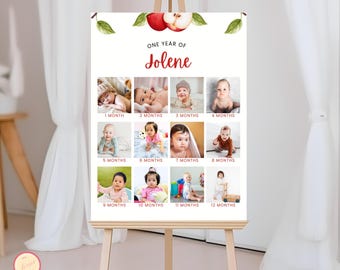 Puede incluir: Un tablero blanco con un diseño de manzana roja en la parte superior. El tablero está dividido en 12 cuadrados, cada uno con una foto de un bebé a diferentes edades. El texto "One Year of Jolene" está en la parte superior del tablero.