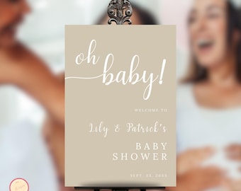 Pode incluir: Uma placa de boas-vindas bege com o texto "oh baby!" em escrita cursiva branca. A placa também inclui o texto "Bem-vindos ao Chuveiro de Bebê de Lily & Patrick Sept. 23, 20XX".