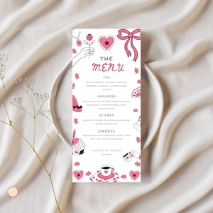 May include: A menu card with a pink and white design, featuring illustrations of hearts, bows, and teacups. The menu lists tea, savories, scones, and sweets. The text "THE MENU" is at the top, with "Elizabeth's 30th Birthday" at the bottom.