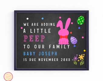 May include: A chalkboard announcement with a pink bunny rabbit and colorful Easter eggs. The text reads "We are adding a little peep to our family. Baby Joseph is due November 20XX."