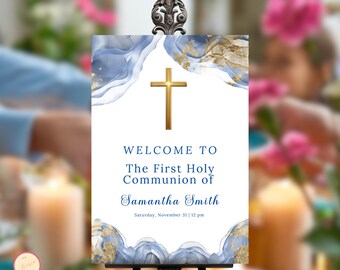 May include: Welcome to the First Holy Communion of Samantha Smith, a blue and gold sign with a cross and a watercolour background.