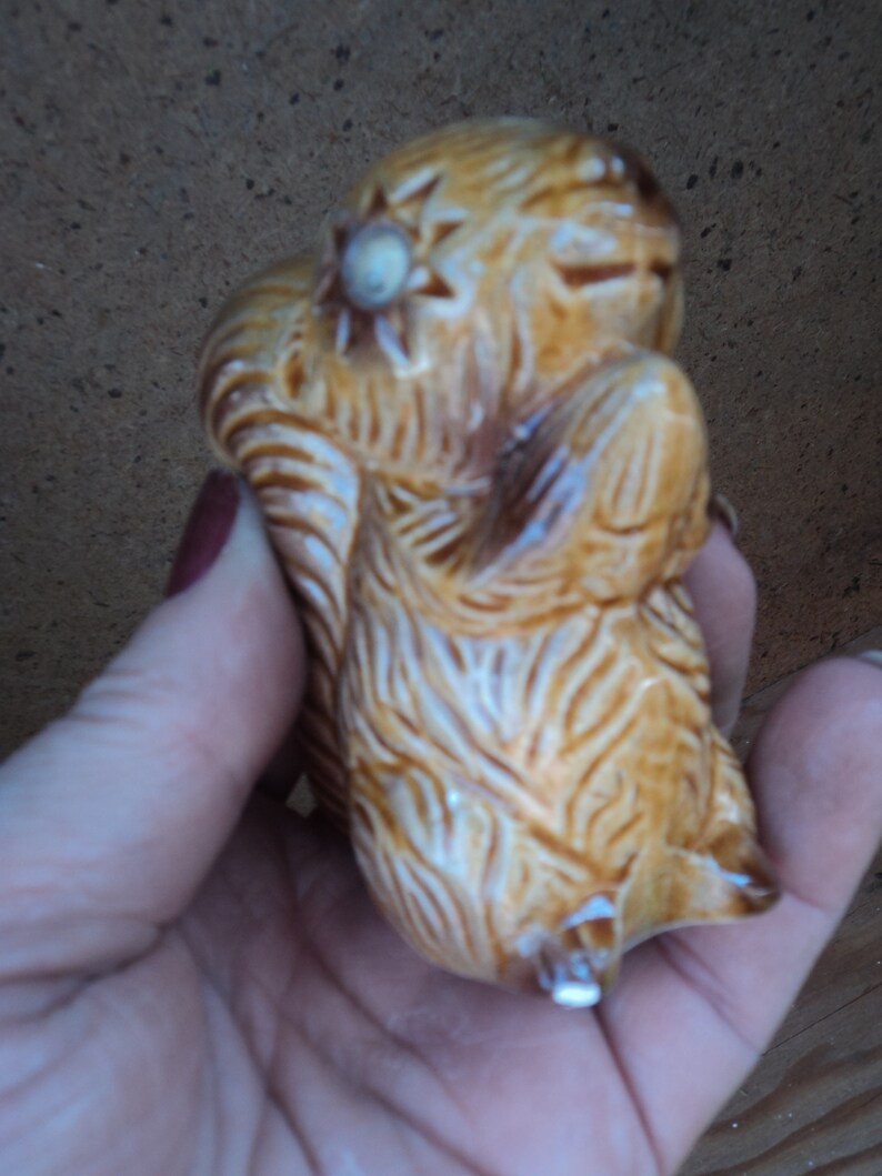 vintage ceramic squirrel and bear salt and pepper shakers with squiggly eyes