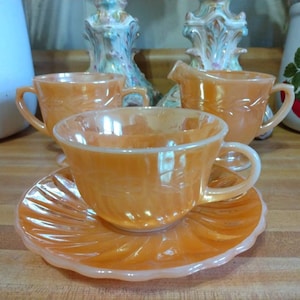 Four pieces Vintage  Anchor Hocking peach swirl Suburbia 6 inch saucer and matching Fire King Oven Ware coffee cup, creamer and sugar bowl