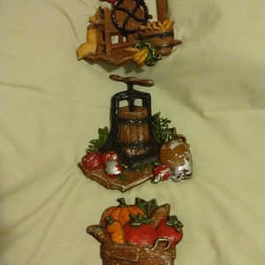 Vintage Sexton metal wall plaques corn sheller apple press and basket of veggies and fruit kitchen decor