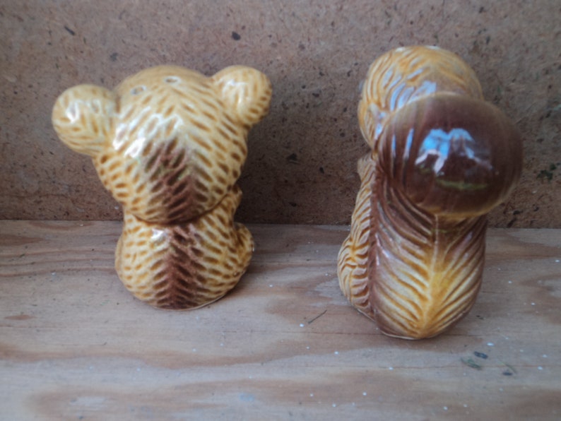 vintage ceramic squirrel and bear salt and pepper shakers with squiggly eyes