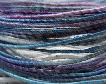 wool, silk, and bamboo fiber wire, shades of purple, teal and cream, coated copper wire