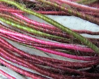 Wool fiber wire in pink, burgundy, peach, and olive.  craft wire in colors of tourmaline.  core spun craft wire.