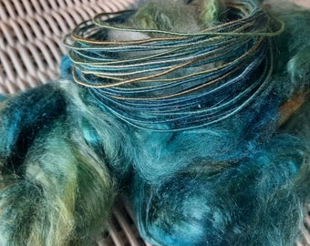 100% Silk fiber wire in teal, blue, green, and gold.  Core spun craft wire