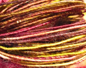 Wool fiber wire in deep burgundy, rose, and olive